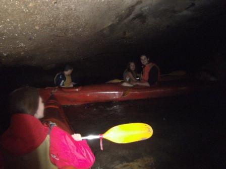 Lali kayaking inside the cave looking for the hidden lake