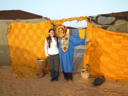 Lali at the entrance to the shopping complex along with the Berber who guided us through the desert